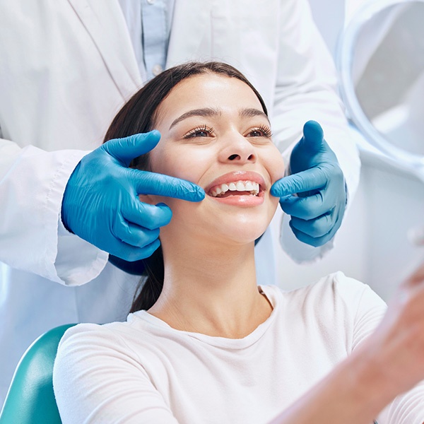 Patient receiving professional dental treatment in Newport Beach and Costa Mesa, CA.